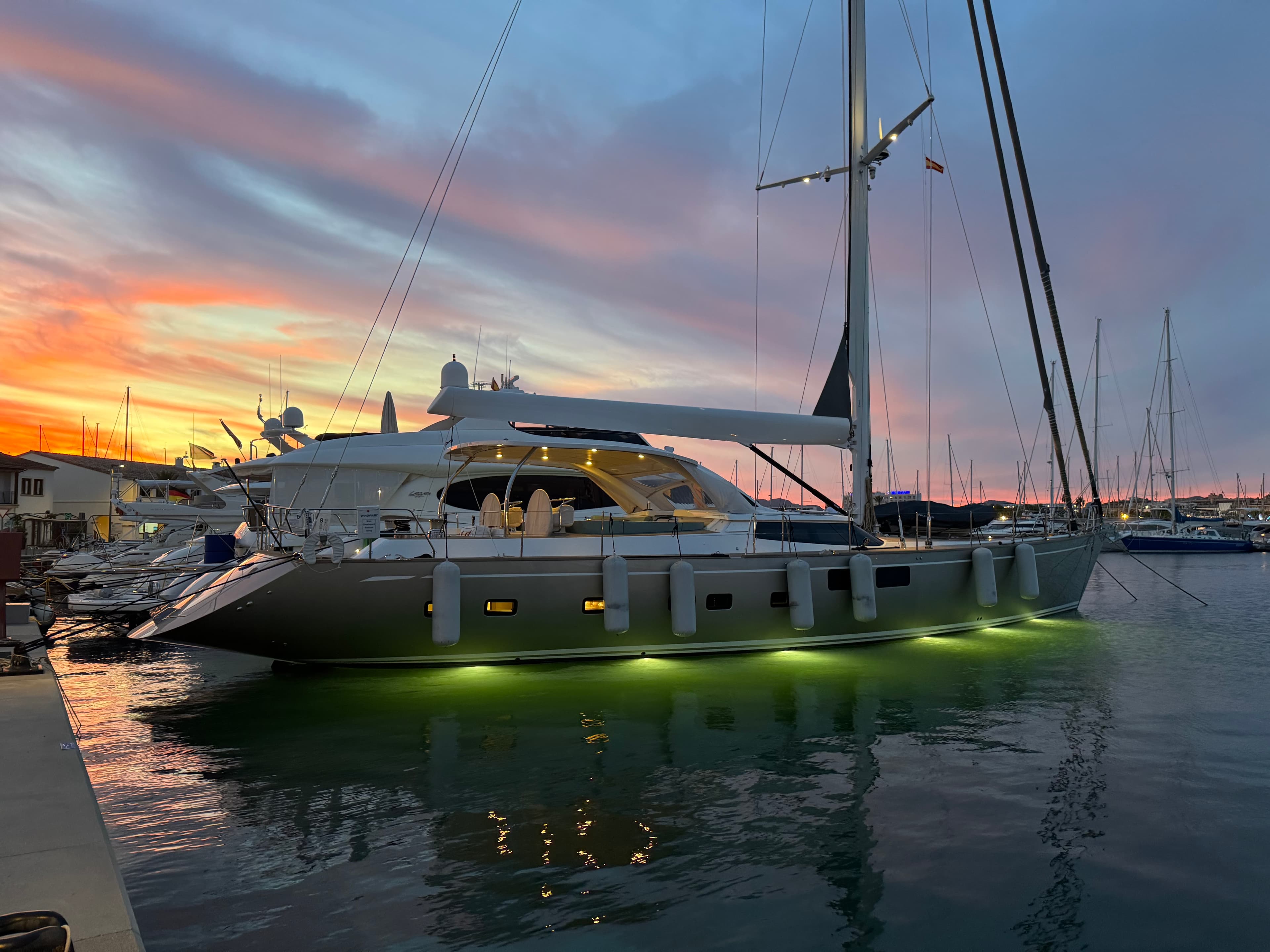 SY Eleanor yacht at sunset with underwater lights illuminating the sea